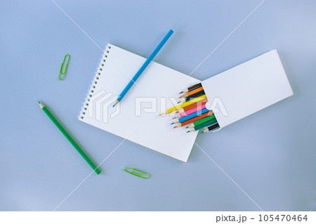Back to school, colorful sticky notes and multicolored pencils, drawing supplies on gray blue background with copy space, top view, flatly 105470464