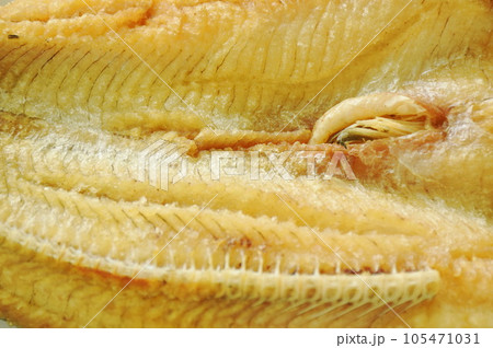 deep fried striped snake head fish with salt on plate deep fried striped snake head fish with salt on plate 105471031