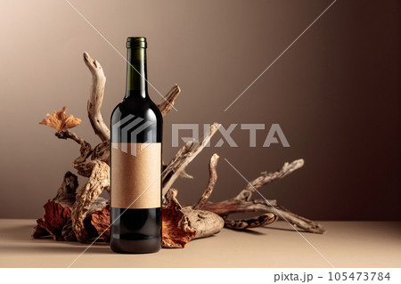 Bottle of red wine with a composition of old wood. Bottle of red wine with a composition of old wood. 105473784