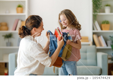 Happy family preparing for school 105474429
