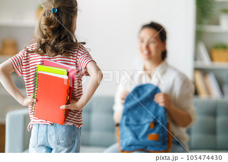 Happy family preparing for school 105474430