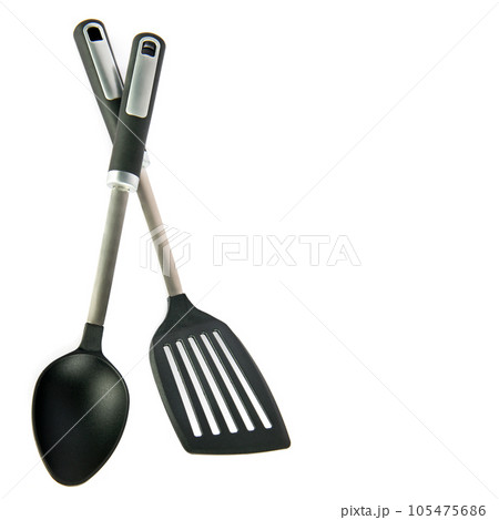Kitchen spatula and spoon isolated on white . Free space for text. Kitchen spatula and spoon isolated on white . Free space for text. 105475686