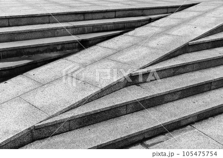 Gray stone stairs with a ramp, abstract urban architecture Gray stone stairs with a ramp, abstract urban architecture 105475754