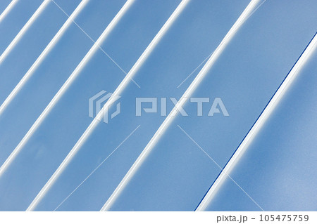 New roof made of shiny stainless steel plates New roof made of shiny stainless steel plates 105475759