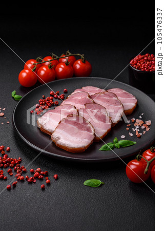 Delicious smoked bacon with salt, spices and herbs Delicious smoked bacon with salt, spices and herbs 105476337