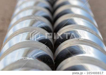 Angle view Close-up injection machine screw spare parts injection machine manufacturing process concept. 105480817