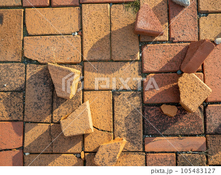 Old brickwork. Bricks on the ground. Construction works. Brick block. Demolition work. Stones on the ground. 105483127