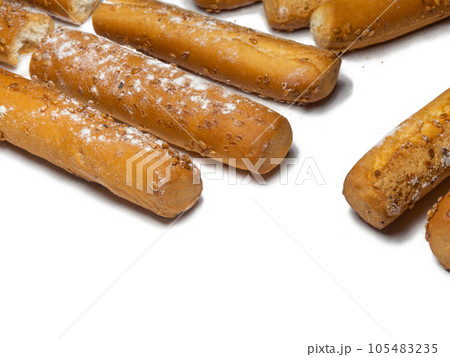 Sesame biscuits on a white background. Biscuits are elongated in the form of sticks. Bread products Sesame biscuits on a white background. Biscuits are elongated in the form of sticks. Bread products 105483235