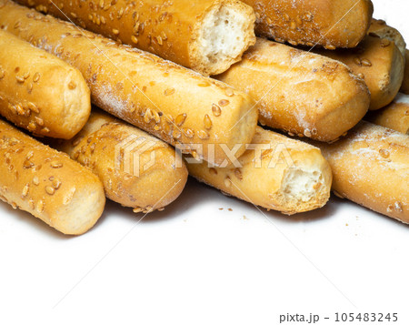 Sesame biscuits on a white background. Biscuits are elongated in the form of sticks. Sesame biscuits on a white background. Biscuits are elongated in the form of sticks. 105483245