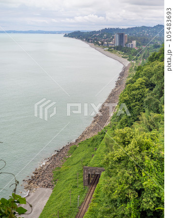 View from the hill to the city and the railway tunnel. Tunnel entrance. Green zone. Railway. 105483693