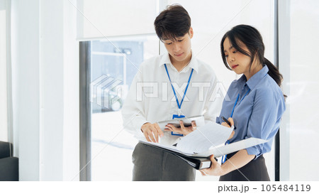 Employees discuss brainstorming planning business strategy together in the office 105484119
