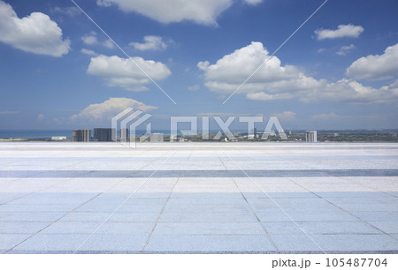 Vast open space, empty floor and city 105487704