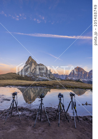 Camera on a tripod in the landscape, Giau Pass (Passo Giau), Dolomites Alps, South Tyrol, Italy 105488749
