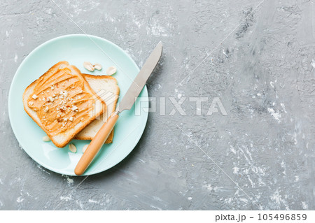 Peanut butter sandwiches or toasts on light table background.Breakfast. Vegetarian food. American cuisine top view vith copy space Peanut butter sandwiches or toasts on light table background.Breakfast. Vegetarian food. American cuisine top view vith copy space 105496859