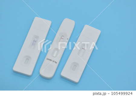 covid test kit on blue background covid test kit on blue background 105499924