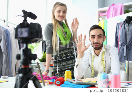 Team of artist designers creates fashionable clothes in studio 105502834