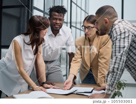 Cheerful colleagues discussing project in modern office 105503001