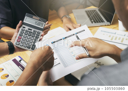 Business team meeting and discussing project plan. Businessmen discussing together in meeting room. Professional investor working with business project together. Finance managers task. 105503860