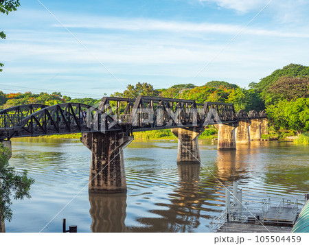 The train is passing through the Death Railway Bridge over the River Kwai in Kanchanaburi.  During World War Two Japan constructed railway from Thailand to Burma This is now know the Death Railway. 105504459