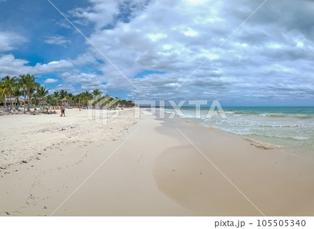 View over a tropical beach with turquoise blue water during the day View over a tropical beach with turquoise blue water during the day 105505340