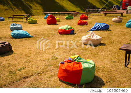 Many colorful bean chairs at the park 105505469