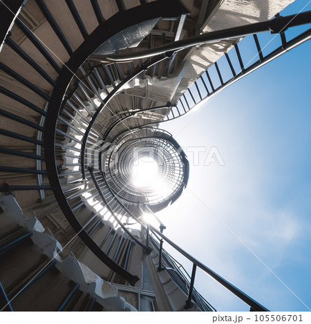 Spiral spiral staircase leading high up into the sky, photo from below 105506701