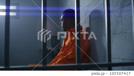 Guilty prisoner sits and thinks about freedom 105507417