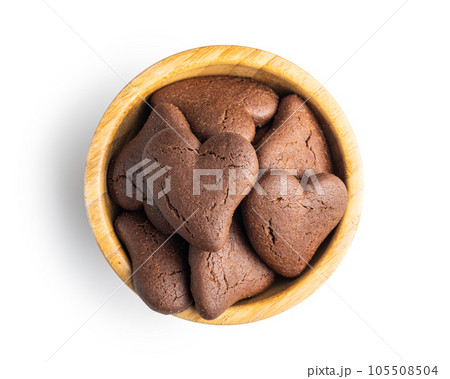 Heart shaped cookies in bowl isolated on white background. Heart shaped cookies in bowl isolated on white background. 105508504