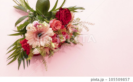 Real Beautiful Fresh Bouquet Of Flowers On Pink Background. Colorful Mixed Roses, Carnation Shabot, Green Leaves, Gerber. Horizontal Plane, Copy Space For Text 105509857