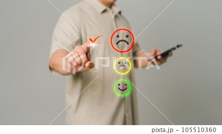 Client hand is touching virtual screen on the angry emotion face. Assessment testimonial review for dislike service and low quality. Business service concept of customer experience dissatisfaction. Client hand is touching virtual screen on the angry emotion face. Assessment testimonial review for dislike service and low quality. Business service concept of customer experience dissatisfaction. 105510360