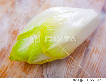 Raw organic endives on wooden table Raw organic endives on wooden table 105513149
