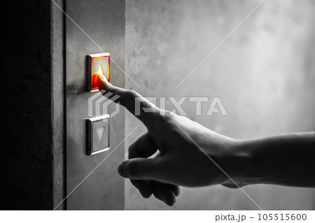 woman finger presses the elevator up button upper high level floor. woman finger presses the elevator up button upper high level floor. 105515600