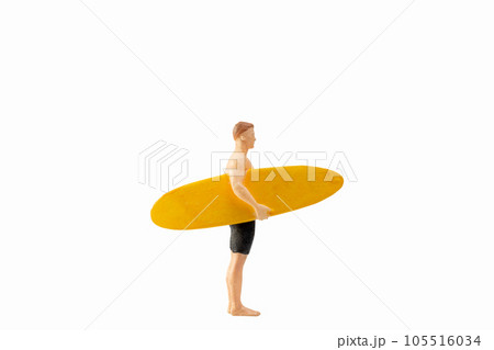 Miniature people man holding a yellow surfboard, isolated on white background with clipping path Miniature people man holding a yellow surfboard, isolated on white background with clipping path 105516034