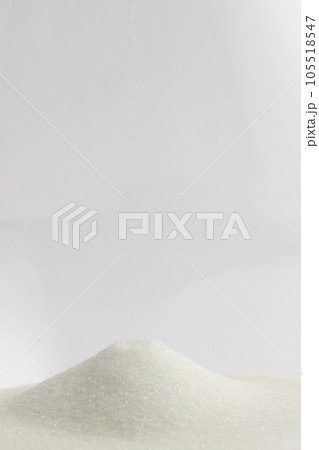 Close up of hourglass with white sand and copy space on white background Close up of hourglass with white sand and copy space on white background 105518547