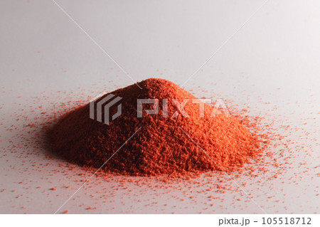 Close up of heap of orange sand and copy space on white background Close up of heap of orange sand and copy space on white background 105518712