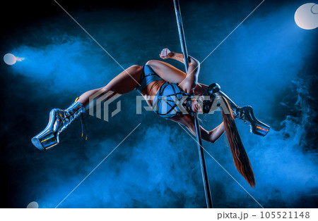 Young woman pole dancing 105521148