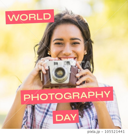 World photography day text on red over happy biracial woman holding outdoors in sun 105521441
