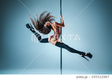 Woman pole dancing 105522067