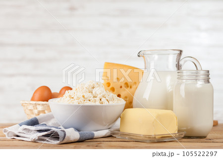 Milk and dairy products on a wooden table 105522297