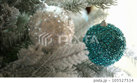 Bright blue Christmas ball on Christmas tree closeup Bright blue Christmas ball on Christmas tree closeup 105527514