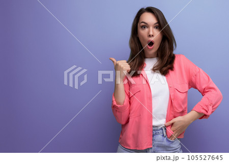 joyful shocked brunette young woman in casual outfit communicates some idea over isolated background joyful shocked brunette young woman in casual outfit communicates some idea over isolated background 105527645