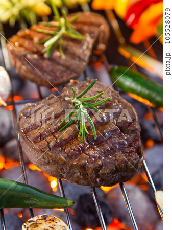 grilling steak on the grill grilling steak on the grill 105528079