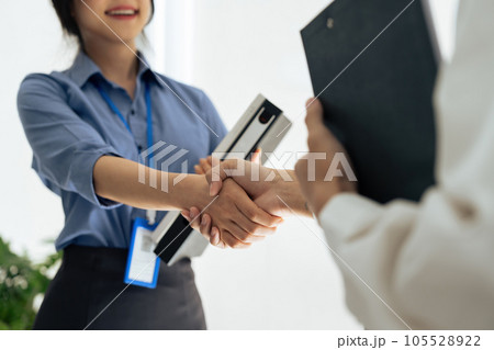Closeup Handshake of employees after successful planning strategy marketing in the office 105528922