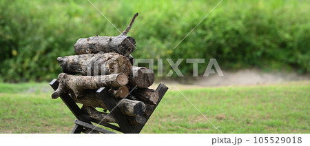 Pile of firewood in campsite, tourism, recreation outside, camping and travel concept 105529018
