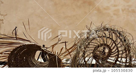Summer in the City: Straw Hats Against a Wall. Horizontal banner 105530830