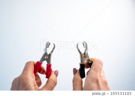 Hands with crocodile alligator clip 105531185