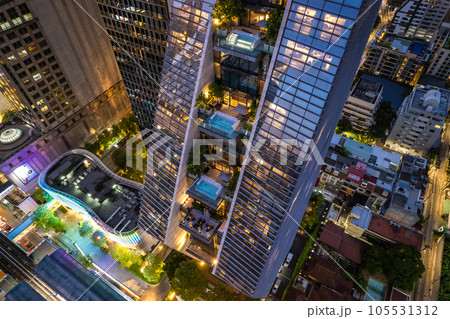Aerial view of Ploenchit road by night in Bangkok Downtown, financial district and business center Aerial view of Ploenchit road by night in Bangkok Downtown, financial district and business center 105531312