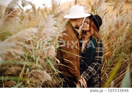 Lovely hipster couple enjoying each other in the autumn park. Nice autumn day. love and lifestyle. 105533646