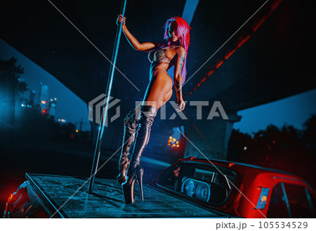 Pole dancing in city 105534529