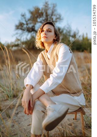 Portrait of elegant, luxury woman posing in nature. People, lifestyle, relaxation concept. 105534799